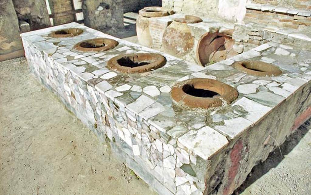 IV.16, Herculaneum. October 2001. Detail of counter-top with inset dolia. Photo courtesy of Peter Woods.